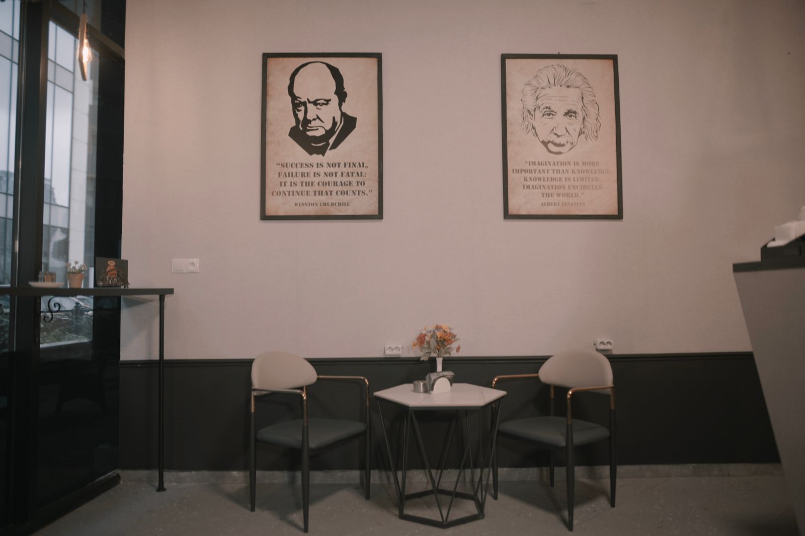 Wall decor featuring quotes from Winston Churchill and Albert Einstein at 7 Degrees Lounge in Batumi